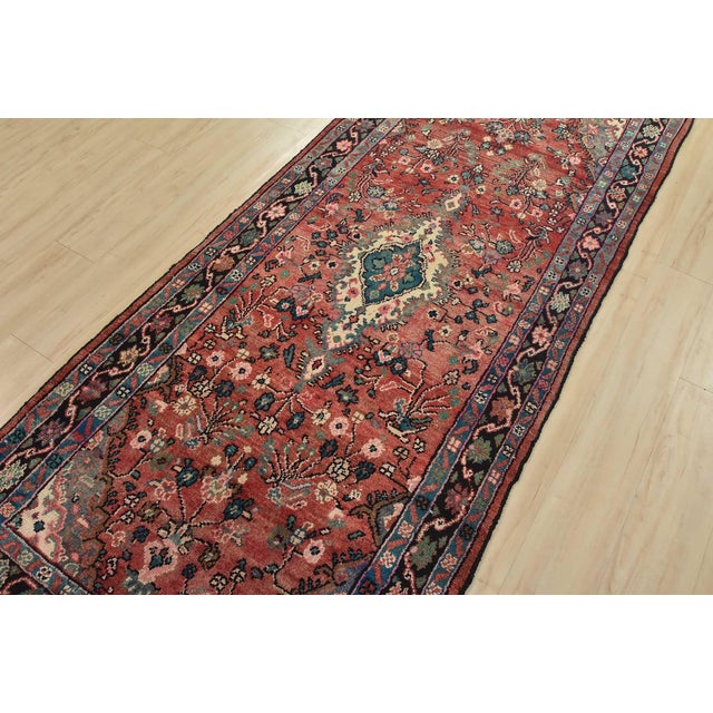 An authentic semi-antique traditional Malayer runner hand-knotted with fine wool and natural dyes. This oriental rug...