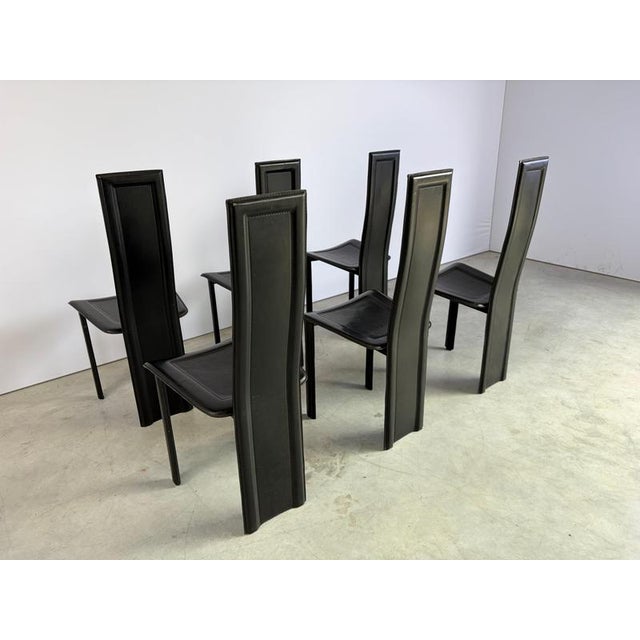 Set of 6 black italian leather high back dining chairs. beautiful sleek and timeless design. The chairs are in good...