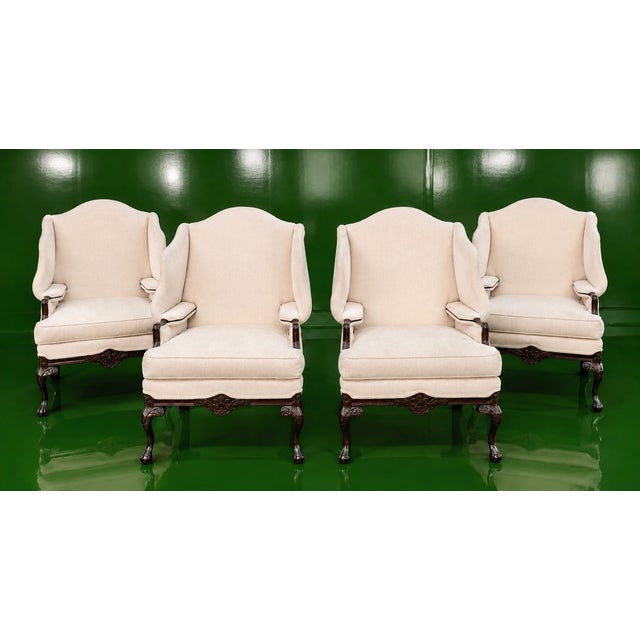 An exceptional set of four wingback lounge chairs by the esteemed American maker Harden Furniture, masterfully crafted in...