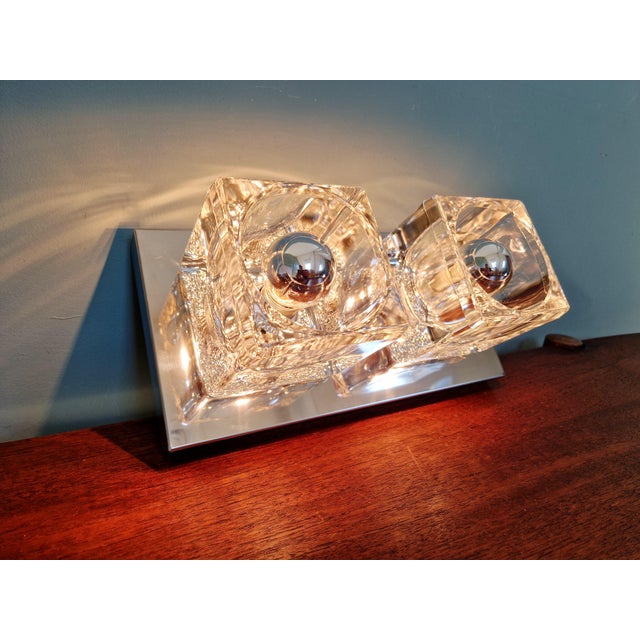 Double wall sconce in chrome-plated metal and ice cube glass, produced by the german manufacturer peill & putzler, 1970s....