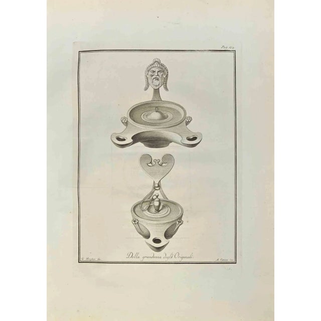 Pompeian Style Oil Lamps from "Antiquities of Herculaneum" is an etching on paper realized by Aniello Cataneo in the 18th...