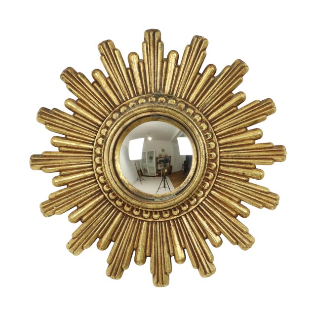 Small vintage sunburst mirror made of gold-colored polyresin, a type of hard plastic, typical of a mirror from Italy from...