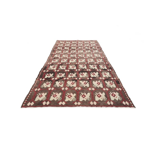 Vintage handwoven decorative kilim rug from Kars region of Turkey. Approximately 50-60 years old. In very good condition.