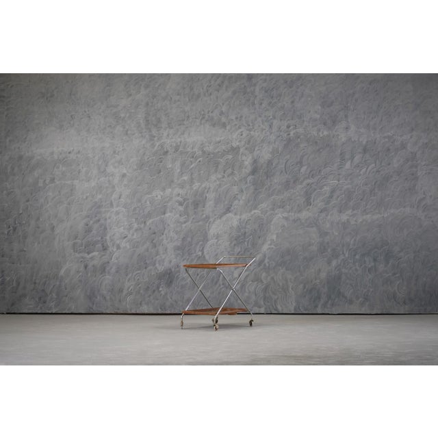 A versatile and stylish 1970s Italian bar cart, crafted from aluminium and plastic, perfect for both dining and living...