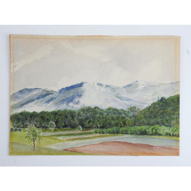 Small mid 20th century watercolor on paper landscape with mountians and orchards. Unsigned. Unframed, age toning, tape...