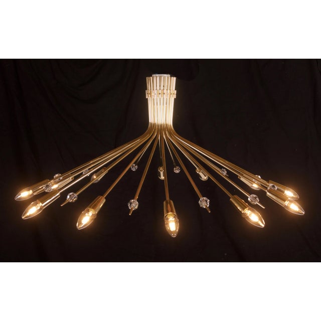 This chandelier or ceiling light was designed and produced by J.T Kalmar in Vienna, Austria in the 1950s. It is made from...