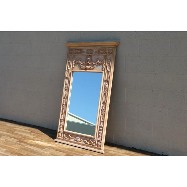 Beautiful vintage Italian hand-carved wood trumeau mirror, dating to the 1950s. This substantial statement mirror features...