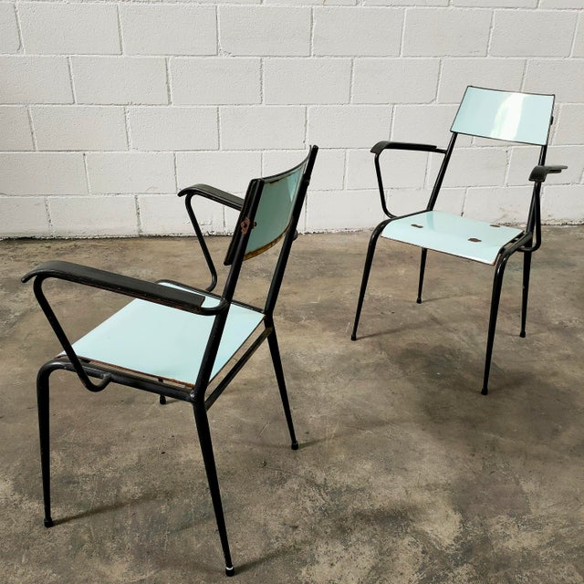Chair with a black steel frame, seat and backrest painted turquoise. Manufactured by Vitriform Barcelona, ​​1960s....
