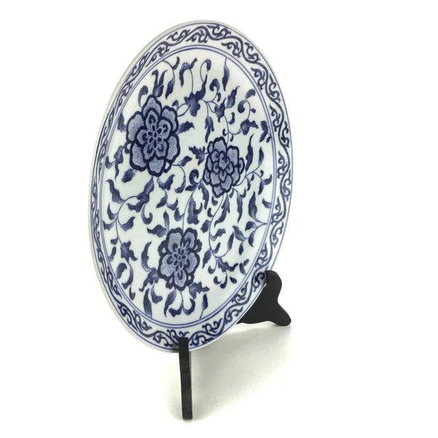 Beautiful scrolling flowers have been hand painted on this heavy ceramic plate. These plates were designed in the 60’s for...