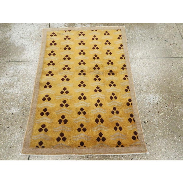 This mid-20th century Turkish Anatolian Deco rug, measuring 2' 11" x 4' 4", features a playful and modernist approach to...