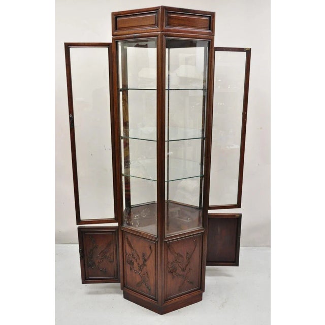 Vintage Oriental Chinoiserie Asian Mahogany Hexagonal Lighted Display Curio Cabinet. Item features double sided entry and...