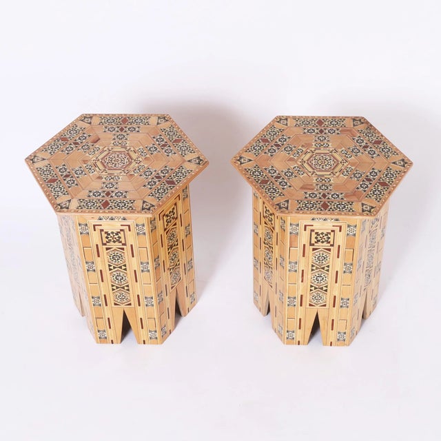 Impressive pair of Moroccan stands with elaborate inlaid geometric marquetry composed of exotic woods such as mahogany,...