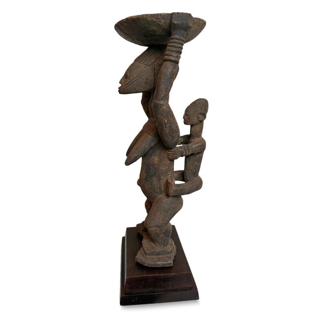 Old and important Afo maternity figure. Exquisitely carved piece with scarification lines on baby and mother figure....