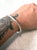Sleek vintage sterling silver hinged bracelet with hammer design.
