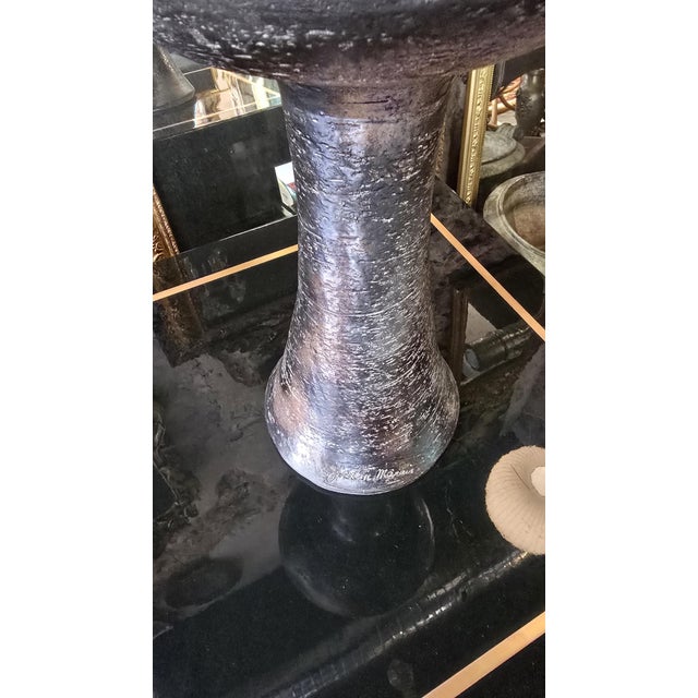 Ceramic vase/candle holder with a tall, truncated conical base, surmounted by a wide circular bowl and a cylindrical...