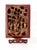 Antique hand carved wood panel on rosewood easel. This beautiful panel is lacquered in red with gilt accented carvings....