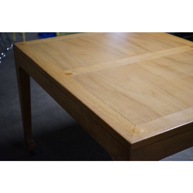 A timelessly designed dining table that Michael Taylor did for Baker Furniture. This table starts out as a rectangle but...