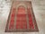 This early 20th century Turkish Oushak rug, is a striking example of the prayer rug tradition, distinguished by its...