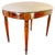 An exquisite Edwardian-era Sheraton Revival oval vanity stool, masterfully crafted from rich mahogany with refined boxwood...