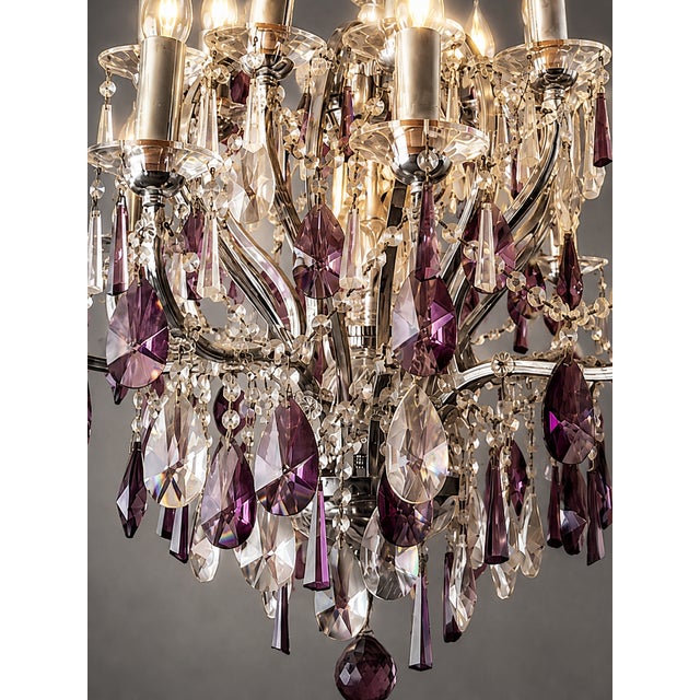 A striking 1990 vintage 16-light chandelier, beautifully crafted from high-quality nickel chrome and richly decorated with...