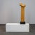 A sculptural biomorphic work dating to the 1970s, executed in carved plum wood and mounted on a solid granite base....