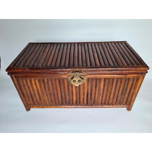 An original bamboo chest in a colonial style, dating from the mid-20th century. Its distinctive construction, made of...