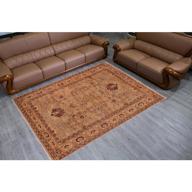 "Enhance the ambiance of your home with this magnificent Persian-influenced Turkish hand-knotted rug made by skilled...