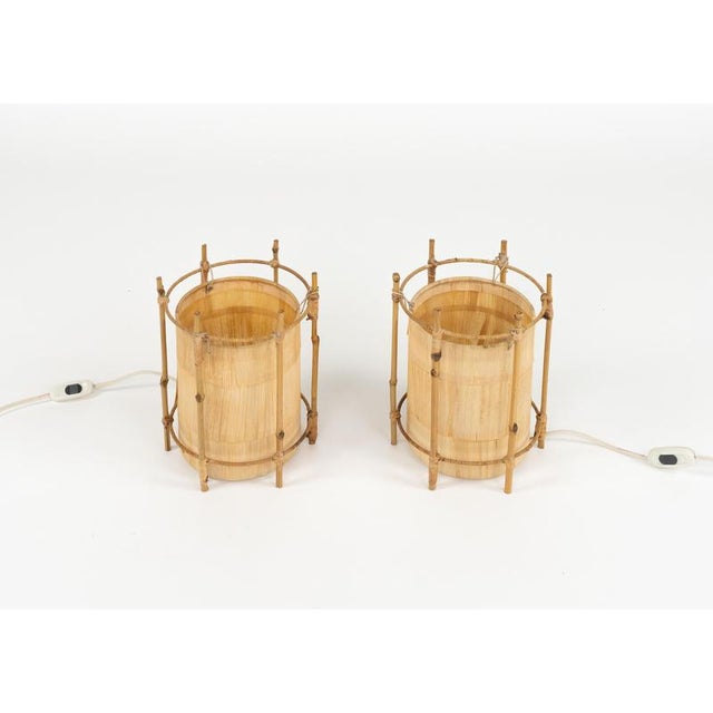 Midcentury amazing pair of table lamps in bamboo and rattan in the style of Louis Sognot. Made in Italy in the 1970s....