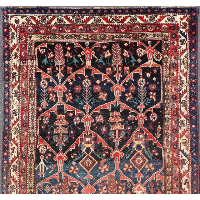 Antique Persian Bakhitari Colorful Rug with All-Over Floral Medallion Design. Keivan Woven Arts: rug EMB-9695-13820;...
