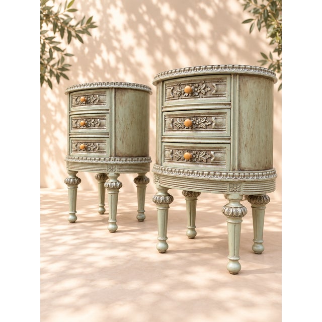 An elegant pair of Louis XVI style bedside tables, dating from the early 20th century, with a beautiful, soft, and...