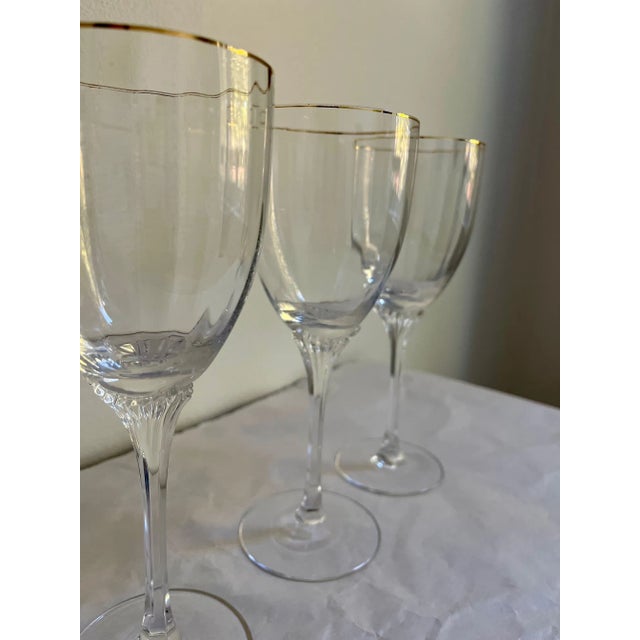 Gorham Crystal's "Golden Horizon" water goblets from the 1990s. Thin gold trim with elegant rib on the cup; decorated...