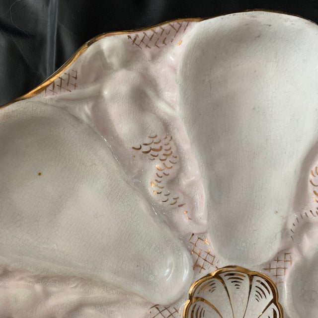 An antique Carl Tielsch porcelain pink and gold oyster from around 1880.
