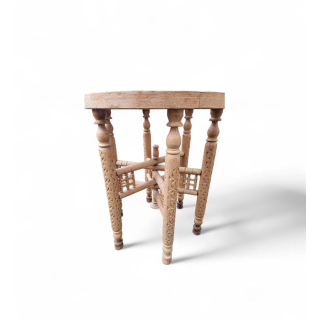 A beautifully crafted vintage stool featuring a hand-carved solid wood frame and an original woven cane (rattan) seat. The...