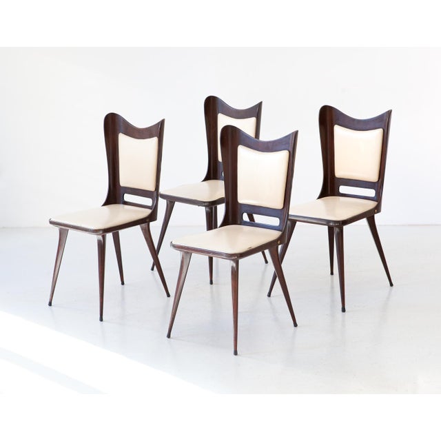 Set of 4 dining chairs manufactured in Italy during the 1950s The frame is made of solid and high quality wood with sings...