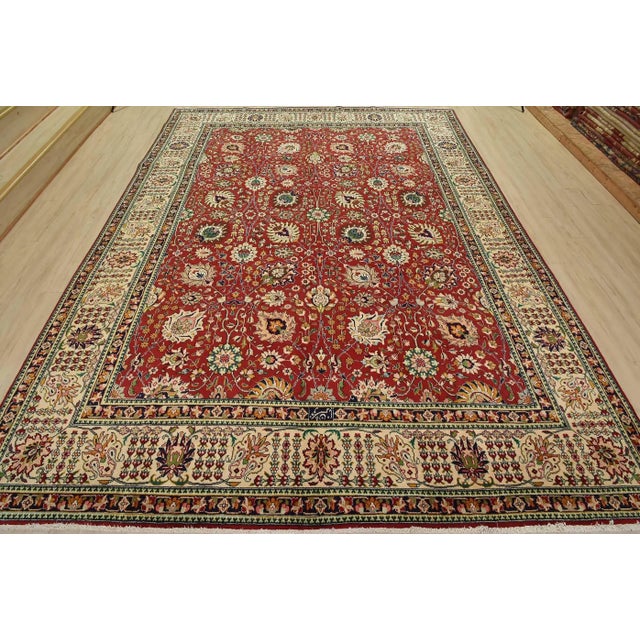 This authentic vintage traditional Tabriz rug is hand-knotted with fine wool and natural dyes. This oriental rug features...