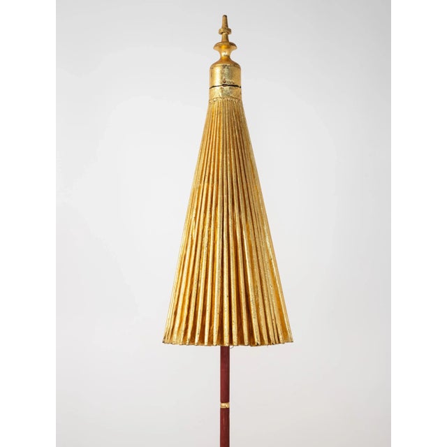 Stunning sun umbrella with a gilt exterior and a painted wood column with a gold finial at the top. The gold umbrella...