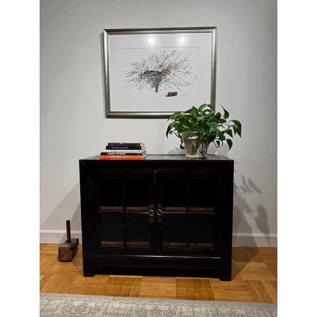 Asian-inspired Ming Small Media Cabinet by Ethan Allen, dating to 2017 and finished in the brand’s richly distressed Aged...