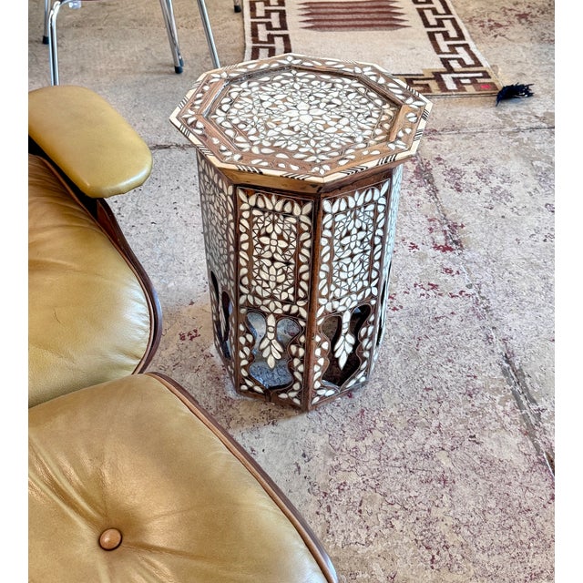 An exceptional mid-19th century Syrian octagonal side table, meticulously handcrafted in Damascus and richly adorned with...