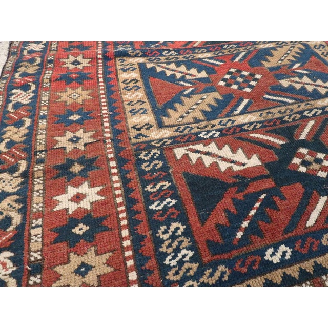 Early 20th Century Galerie Shabab Collection Distressed Caucasian Rug With a Tribal Design in Rust, Dark Blue, and Cream For Sale - Image 5 of 8