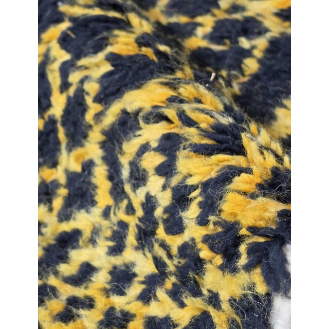 Black & Yellow Moroccan Rug – Handmade Abstract Berber Wool Carpet This bold handmade Moroccan rug features a deep black...