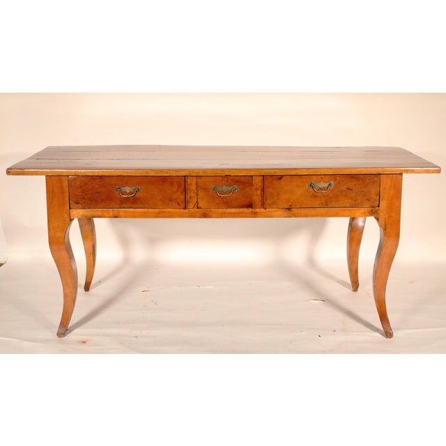 Antique Louis XV style provincial fruit wood desk, 19th century. With a 3 board top, 3 frieze drawers with brass hardware,...