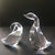 A captivating pair of authentic Mid-Century Modern solid crystal waterfowl sculptures by Steuben Glass, designed by Lloyd...