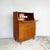 A neat, well made teak writing bureau by Jentique, packing a proper desk and plenty of storage into a compact footprint....