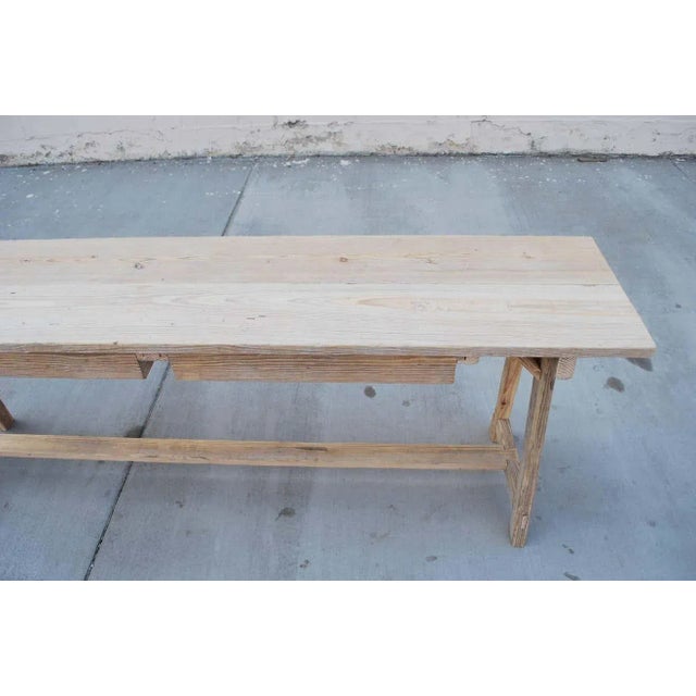 This reclaimed pine console table has a great patina, its legs are splayed in both length and width axis and it has two...