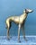 This exceptional vintage monumental greyhound sculpture is a masterful study in movement, balance, and refined form....