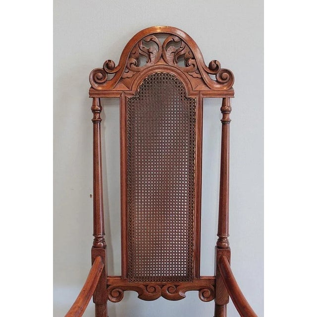 Large colonial armchair in teak turned and carved with volutes, in the charles ii taste (king of england, ireland and...