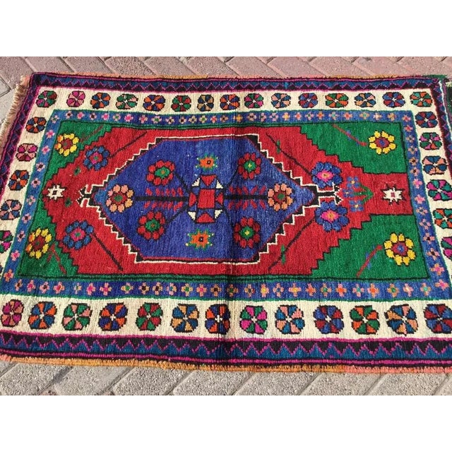 This gorgeous hand knotted Vintage Anatolian area rug is approximately 60 years old in excellent vintage condition. The...