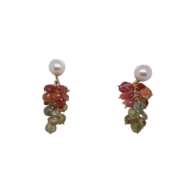 A vibrant and elegant pair of estate 14K gold cluster drop earrings featuring luminous 8.5 mm cultured pearls paired with...