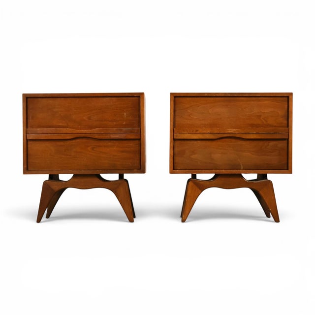 This pair of 1960s Tobago nightstands brings sculptural Canadian mid century modern design to the bedside, built in walnut...