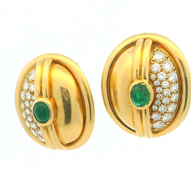 Elegant vintage earrings crafted in solid 18-karat yellow gold, featuring a sculptural domed silhouette accented by vivid...